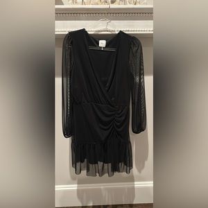 Sheer black cocktail dress . Fun and comfortable fabric